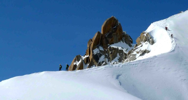 Climbers descending from the Aiguille du Midi en route to Mont Blanc